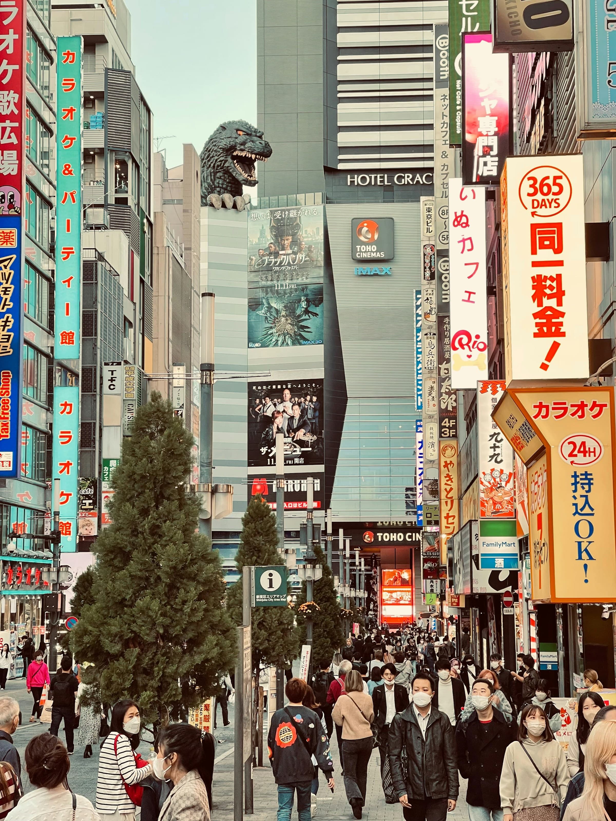 High-rise corridor in Shinjuku with people walking between buildings